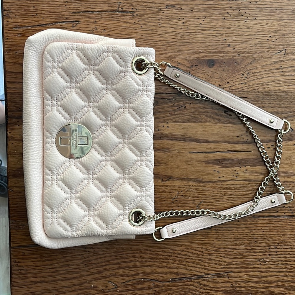 Muted pink leather Kate Spade Bag. In like new condition.